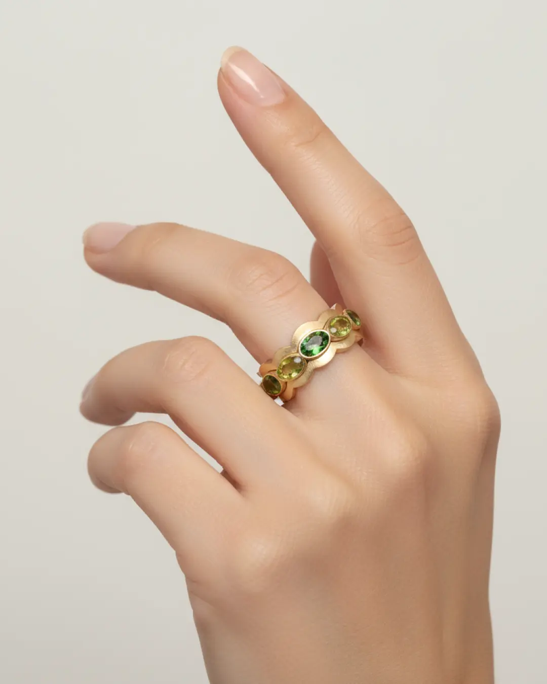 Handcrafted yellow gold ring with green gemstones, custom made in our Los Angeles studio