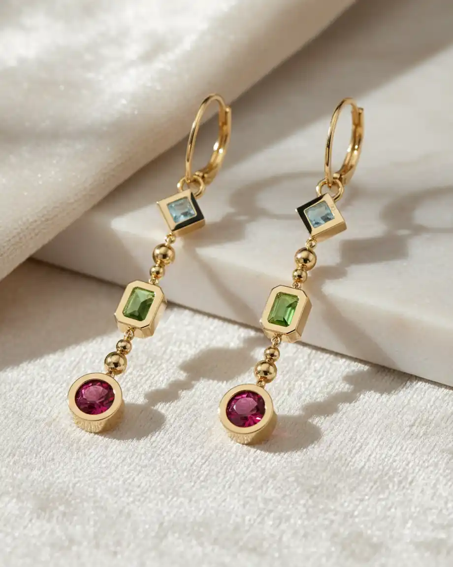 Handcrafted gold drop earrings with blue, green and pink gemstones, custom made in our Los Angeles studio